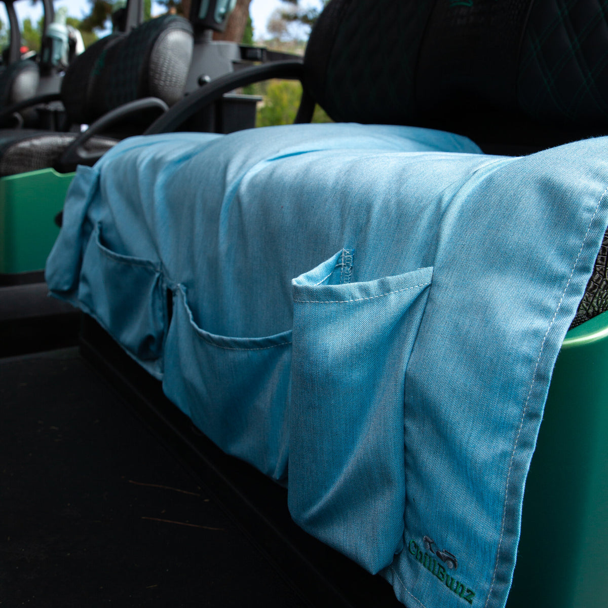 ChillBunz seat cover in Caribbean Blue on a golf cart bench seat