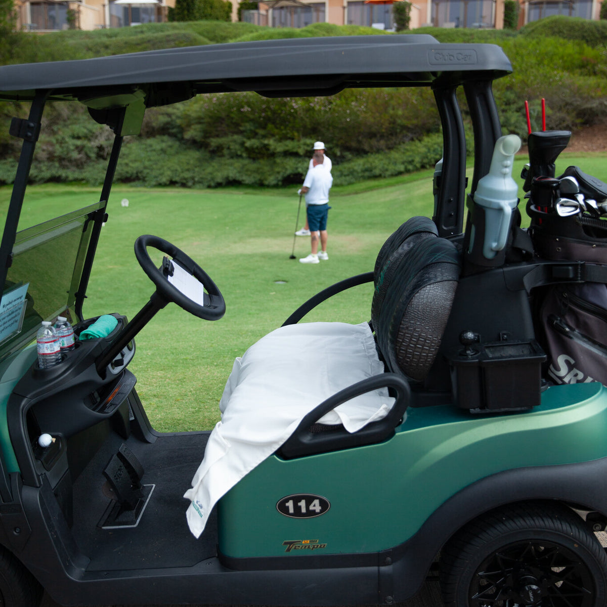 Sand-Tan seat cover installed on a golf cart on the course