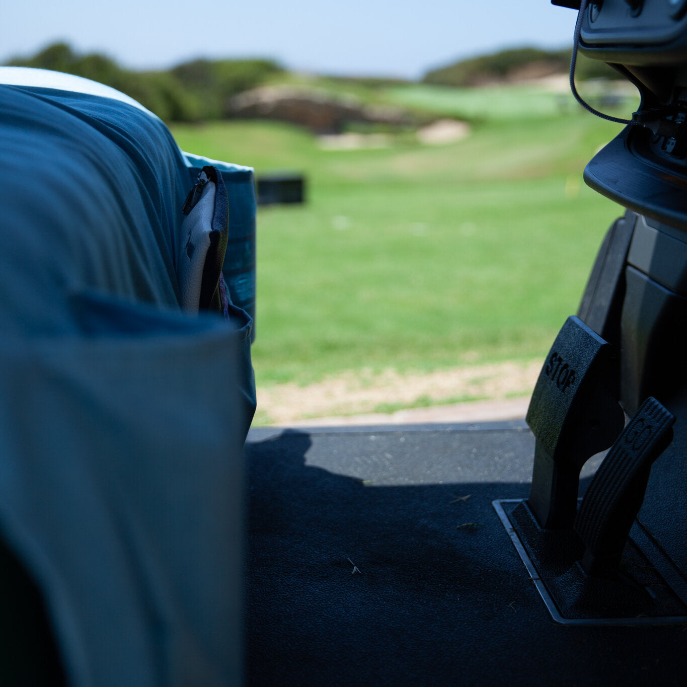 Caribbean Blue seat cover on a golf cart out on the course